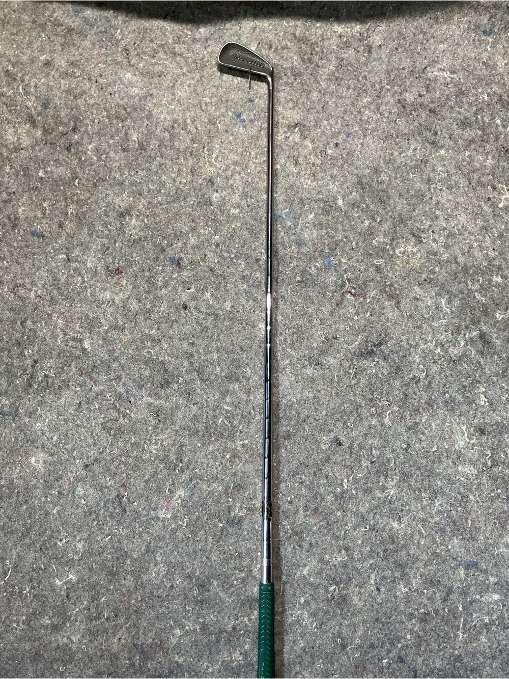 Unbranded Green-Handled Chrome Golf #4 iron  .